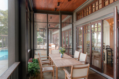 Foto di una veranda minimal di medie dimensioni con pavimento in cemento, soffitto classico, nessun camino e pavimento grigio