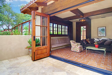 Large mediterranean conservatory in San Francisco with terracotta flooring, no fireplace and a standard ceiling.