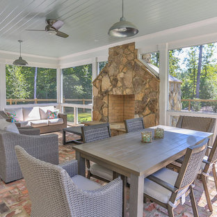 75+ Wintergärten mit Kaminumrandung aus Stein und rotem Boden Ideen