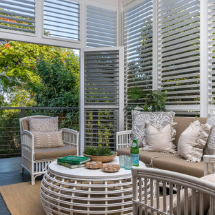 Transitional sunroom in Brisbane with dark hardwood floors, no fireplace and brown floor.