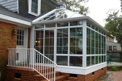 Sunroom - mid-sized traditional dark wood floor sunroom idea in Huntington with no fireplace and a glass ceiling