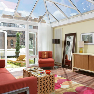 Example of a mid-sized trendy dark wood floor sunroom design in New York with no fireplace and a glass ceiling
