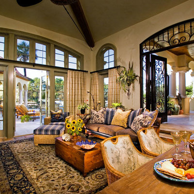 Sunroom - large mediterranean terra-cotta tile sunroom idea in Atlanta with a standard ceiling