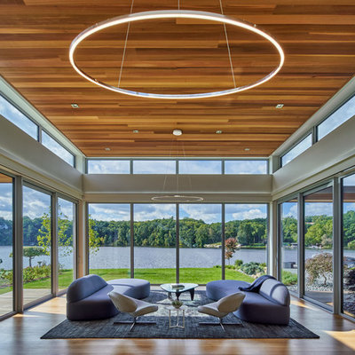 Inspiration for a contemporary light wood floor sunroom remodel in Grand Rapids with no fireplace and a standard ceiling