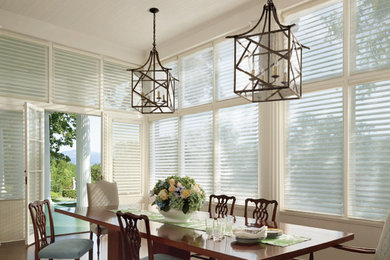 Mid-sized transitional dark wood floor enclosed dining room photo in Other with white walls