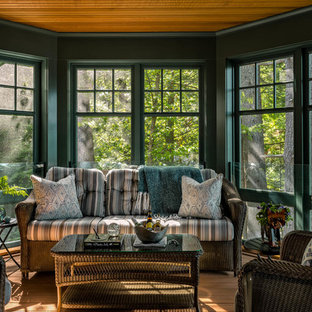 Example of an arts and crafts medium tone wood floor and brown floor sunroom design in Boston with a standard ceiling