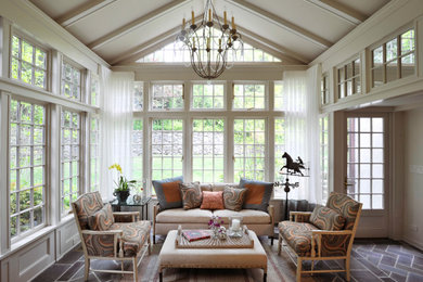 Example of a large classic slate floor and multicolored floor sunroom design in New York with a standard ceiling and no fireplace