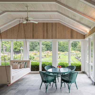 Example of a large classic slate floor and gray floor sunroom design in Minneapolis with a standard ceiling and no fireplace