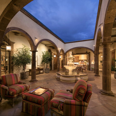 Example of a huge tuscan terra-cotta tile sunroom design in Santa Barbara