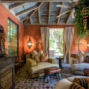 Design ideas for a large mediterranean conservatory in Miami with terracotta flooring, a standard ceiling and brown floors.