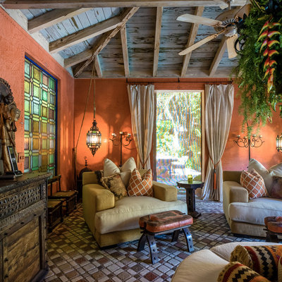 Large tuscan terra-cotta tile and brown floor sunroom photo in Miami with a standard ceiling