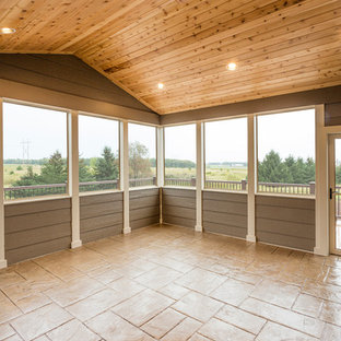Inspiration for a large craftsman travertine floor sunroom remodel in Other with a standard ceiling