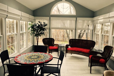 This is an example of a large traditional conservatory in San Diego with laminate floors, no fireplace, a skylight and grey floors.