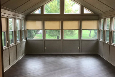 Inspiration for a mid-sized timeless dark wood floor and brown floor sunroom remodel in Columbus with no fireplace and a skylight
