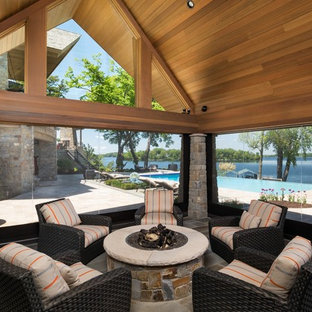 Huge trendy slate floor and gray floor sunroom photo in Minneapolis with no fireplace and a standard ceiling
