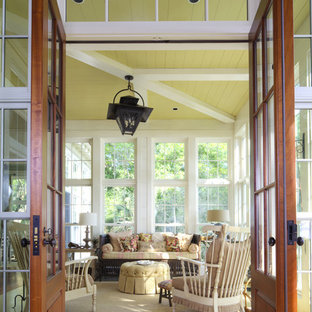Inspiration for a coastal yellow floor sunroom remodel in Other with a standard ceiling