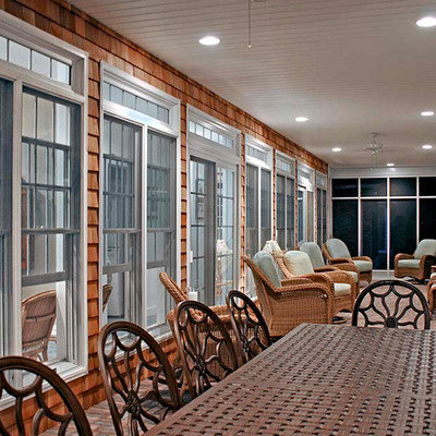 Inspiration for a mid-sized coastal brick floor and red floor sunroom remodel in Toronto with no fireplace and a standard ceiling