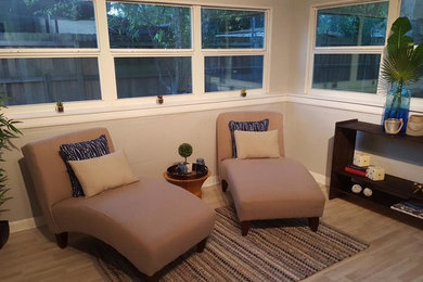 Example of a small trendy laminate floor and brown floor sunroom design in Tampa with a standard ceiling and no fireplace