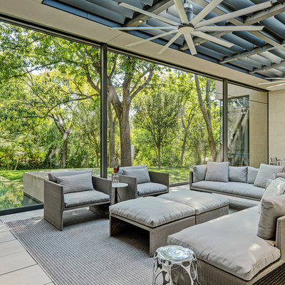 Huge minimalist porcelain tile and beige floor sunroom photo in Dallas with a standard fireplace and a skylight