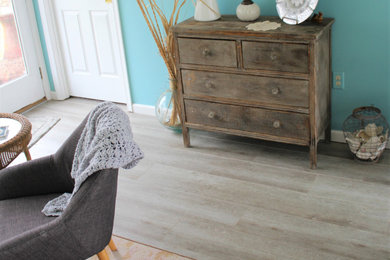 Inspiration for a coastal vinyl floor and gray floor sunroom remodel in Other