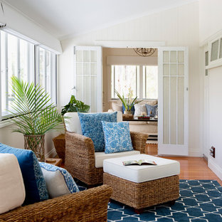 Inspiration for a beach style sunroom in Brisbane with medium hardwood floors and brown floor.