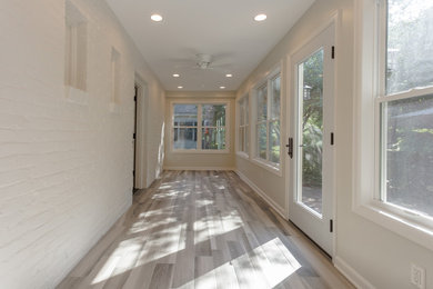 Inspiration for a small timeless ceramic tile and brown floor sunroom remodel in Other with a standard ceiling