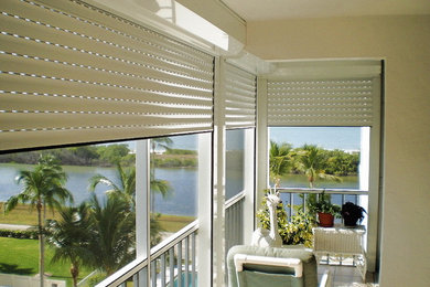 Small island style ceramic tile and white floor sunroom photo in Miami with a standard ceiling