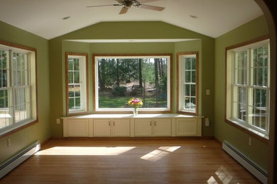 Inspiration for a mid-sized medium tone wood floor sunroom remodel in Raleigh