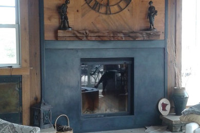 ミネアポリスにある高級な中くらいなコンテンポラリースタイルのおしゃれなサンルーム (濃色無垢フローリング、標準型暖炉、標準型天井、金属の暖炉まわり) の写真