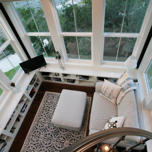 Example of a large beach style dark wood floor sunroom design with no fireplace and a standard ceiling