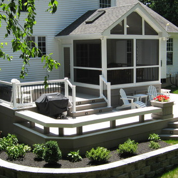 Screened in sunroom with two tier wrap around AZEK deck