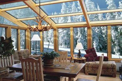 Large mountain style light wood floor sunroom photo in DC Metro with no fireplace and a glass ceiling