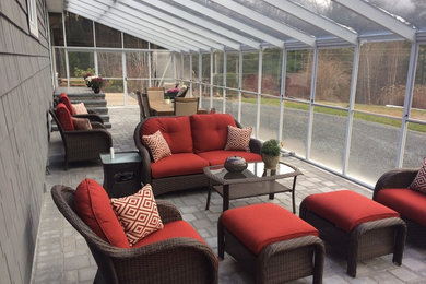 Example of a sunroom design in Other
