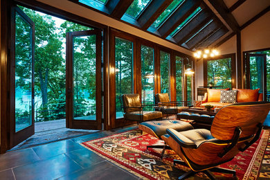Esempio di una grande veranda minimalista con pavimento in gres porcellanato e lucernario