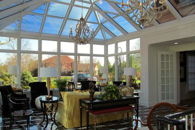 Example of a large transitional brown floor sunroom design in Detroit with no fireplace and a skylight