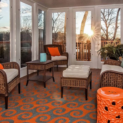 Example of a mid-sized beach style medium tone wood floor and brown floor sunroom design in Boston with no fireplace and a standard ceiling