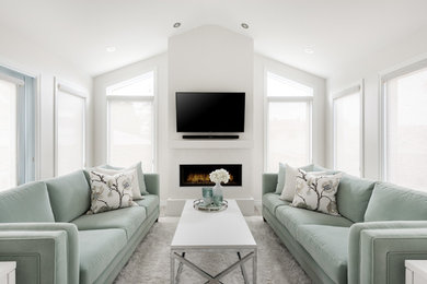 Inspiration for a contemporary ceramic tile and gray floor sunroom remodel in Ottawa with a ribbon fireplace, a concrete fireplace and a standard ceiling
