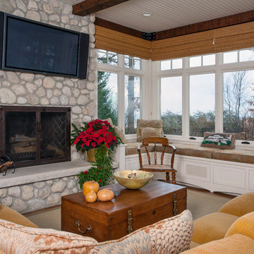 Sun Room with Built In Window Seat, Raised Hearth Stone Fireplace