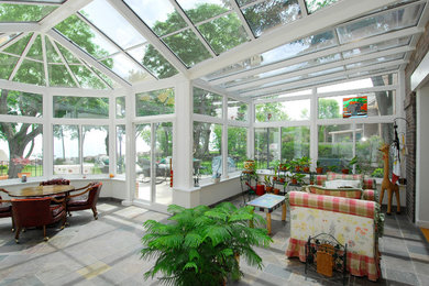 Design ideas for a large traditional conservatory in Chicago with slate flooring, a glass ceiling and grey floors.