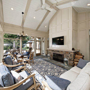 Huge transitional multicolored floor sunroom photo in DC Metro with a two-sided fireplace, a brick fireplace and a standard ceiling