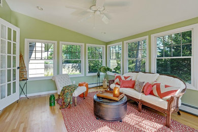 Example of a mid-sized transitional sunroom design in New York