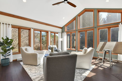 Large transitional dark wood floor and brown floor sunroom photo in Other
