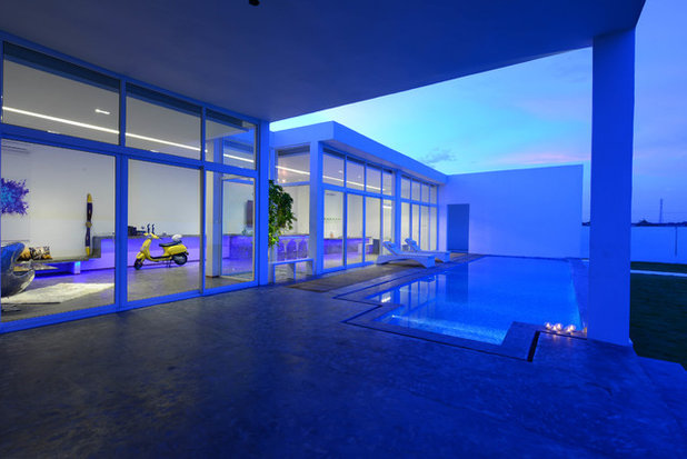 Contemporary Swimming Pool by Aamir and Hameeda Associates