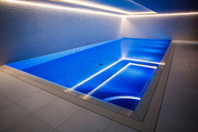Inspiration for a medium sized contemporary swimming pool in Surrey.