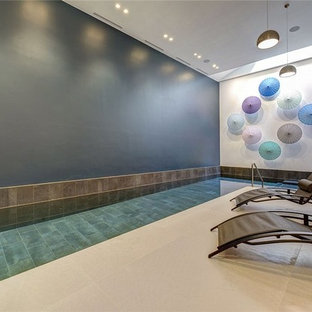Design ideas for a mid-sized contemporary pool in London.