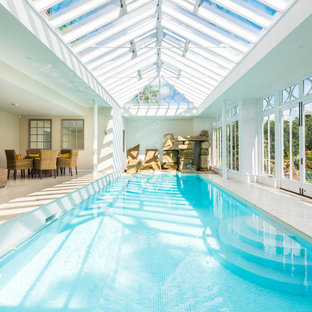 Design ideas for a traditional indoor rectangular lengths swimming pool in Sussex with a water feature and tiled flooring.