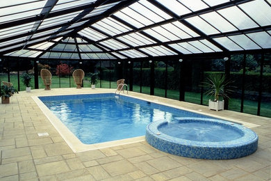 Photo of a traditional swimming pool in Kent.