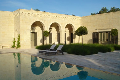 This is an example of a mediterranean swimming pool in Other.