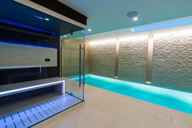 Medium sized contemporary swimming pool in London.