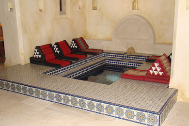 Inspiration for a mediterranean indoor rectangular swimming pool in London with a pool house and tiled flooring.
